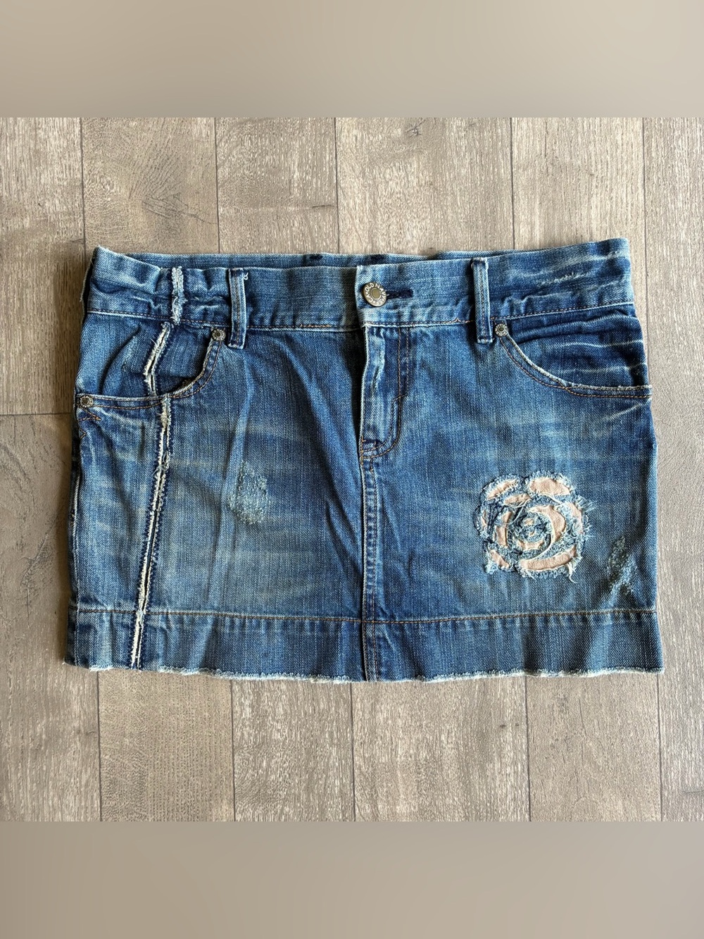 Old Navy Special Edition denim mini skirt with a distressed rose design Size: 6